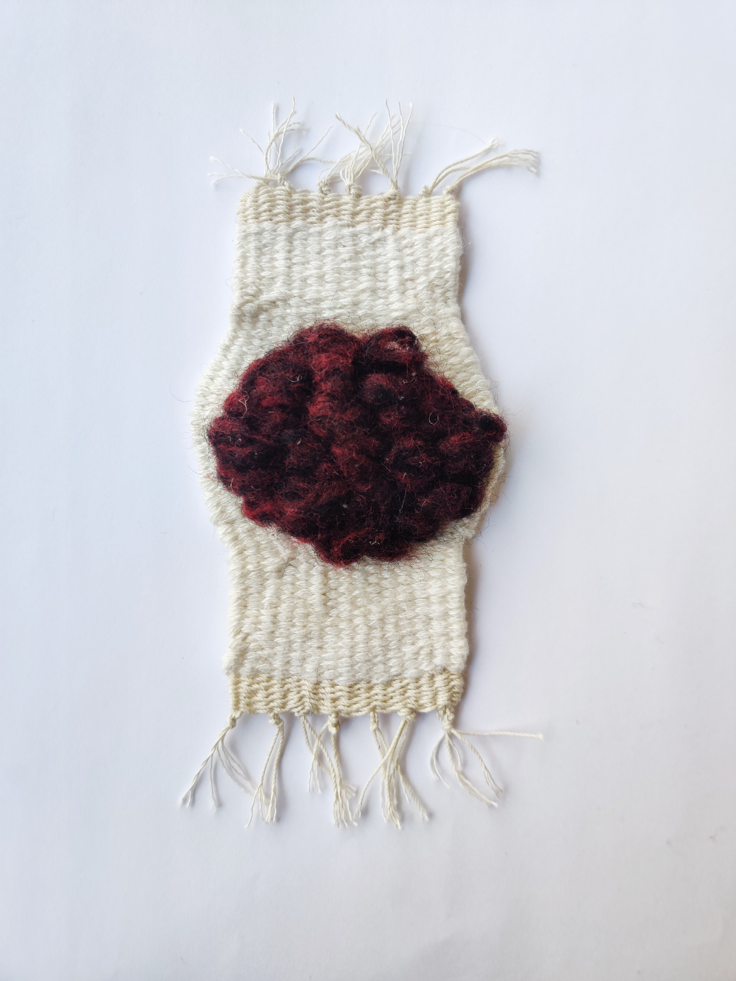 5cm x 12 cm. Cotton, linen and wool. 